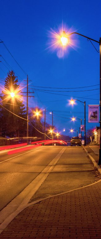 Empty well-lit street at night