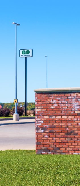 Street with brick wall on grass