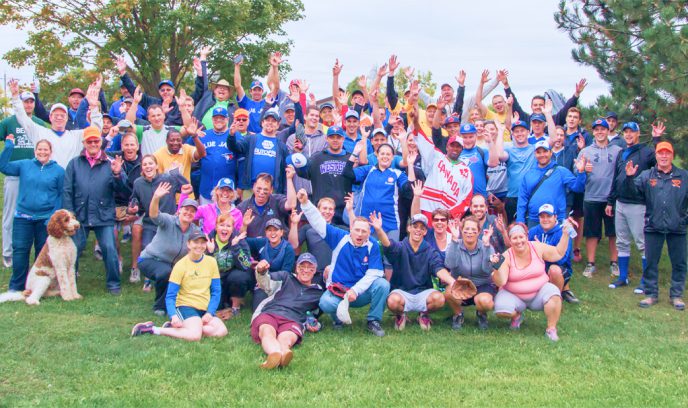 Group of people on a hill cheering