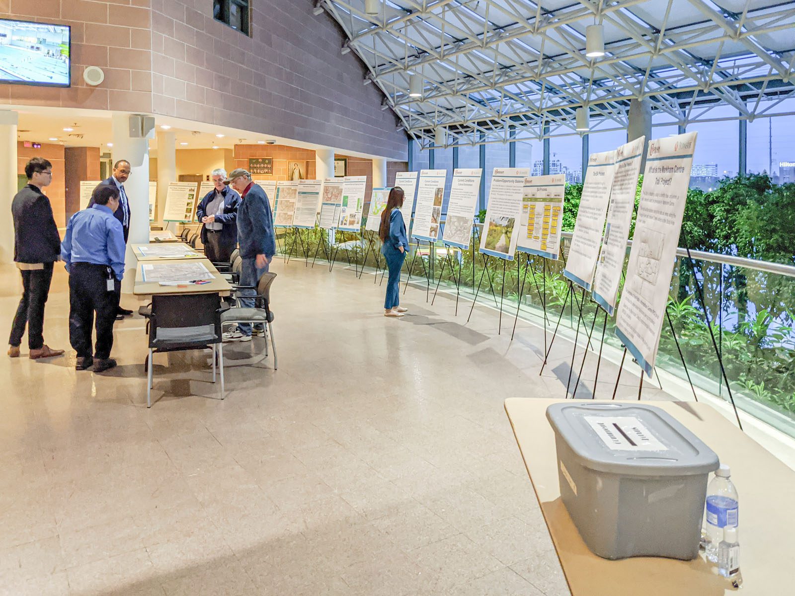 Environmental Assessment and Planning Public Information Consultation Group of People in Large Room with Information Boards