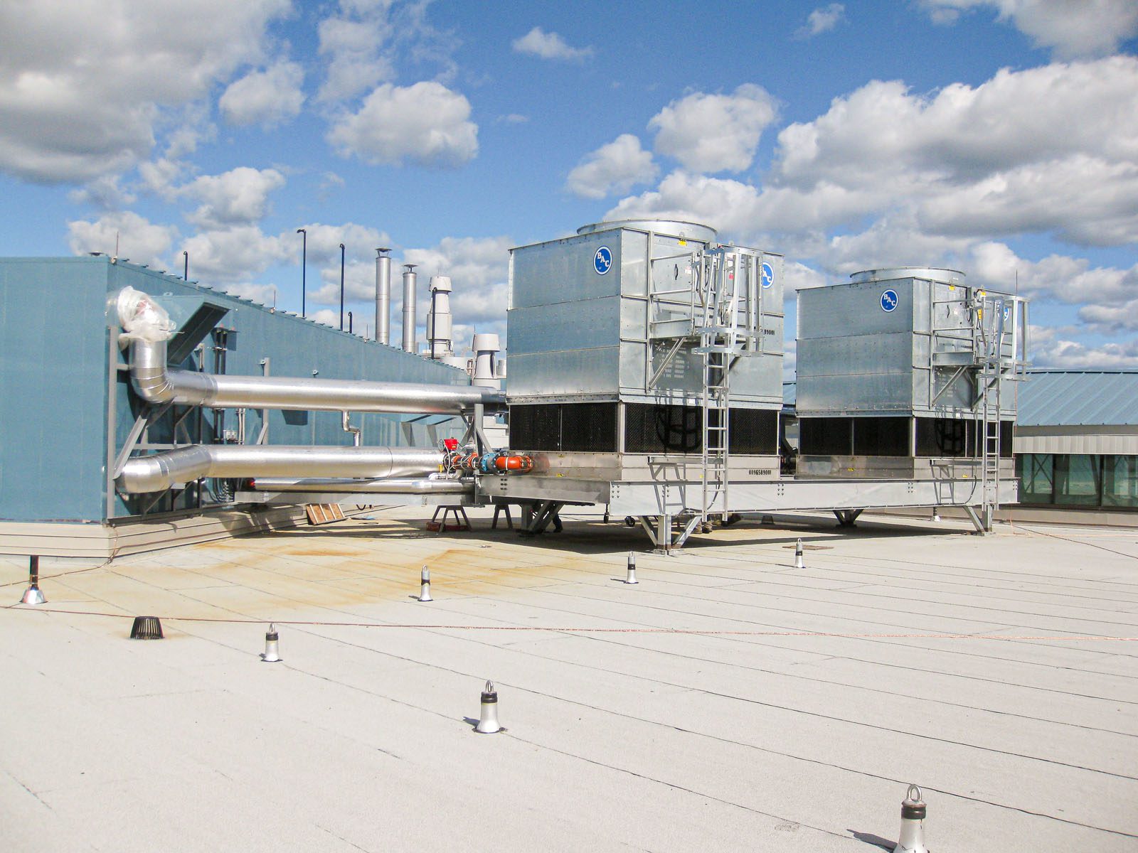 Large Cooling Towers on Industrial Roof Top