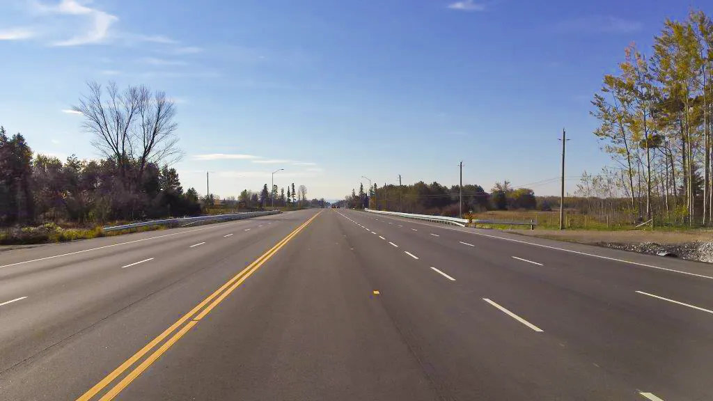 County Road 90 view from centre or roadway looking over bridge crossing