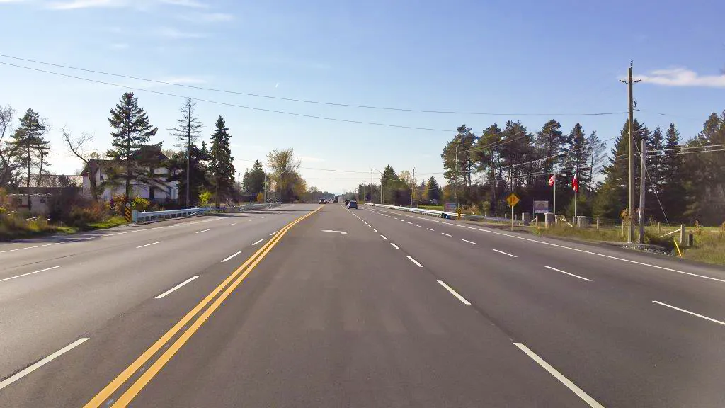 County Road 90 view from centre or roadway looking over bridge crossing