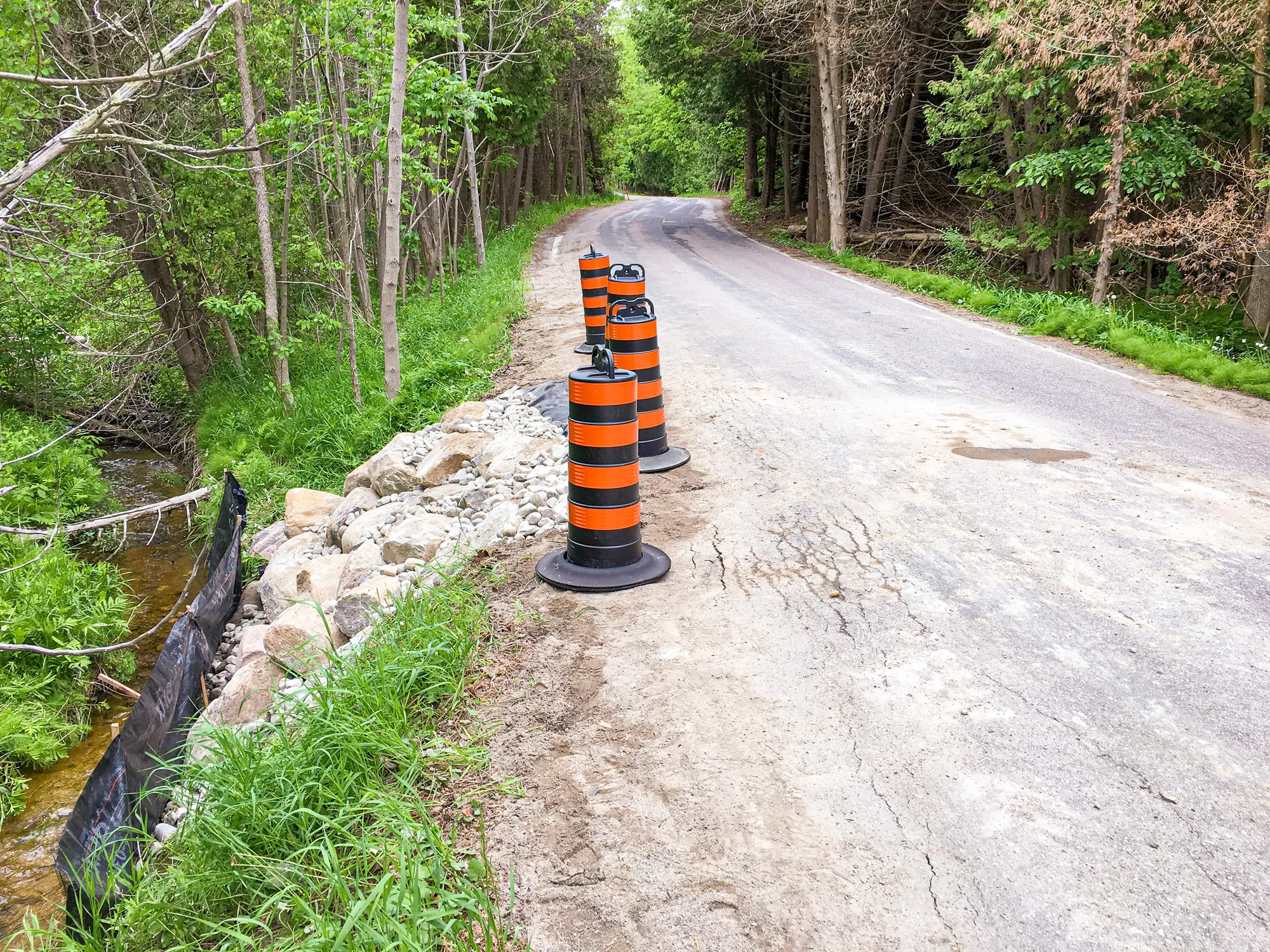 7th Line Road Improvements EA culvert construction showing roadside and river